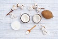 Still life with coconut, coconut flakes and white cotton flower