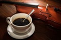 Still life coffee cup with violin.