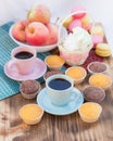 Still life of coffee cups, macaroon cookies, marshmallows and ap Royalty Free Stock Photo