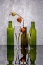 Still life with colored bottles on a reflective surface Royalty Free Stock Photo