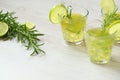 Still life with colorful bright cocktails on wooden background, decorated with rosemary and lime Royalty Free Stock Photo