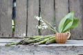 Still life composition with asparagus and ceramic pot with lily-of-the-valley flowers Royalty Free Stock Photo