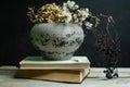 Still life composition.Beautiful dry flowers in an old vase with black background and wooden table Royalty Free Stock Photo