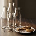 Empty Glass Bottles and Chocolate Chip Cookies on Wooden Table Royalty Free Stock Photo