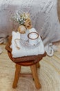 Still life concept, hygge style - cup of coffee, decorative dried flowers