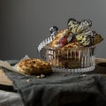 Still life. Cookies in a vase and a butterfly