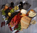 Still life with cooking marine products, wine and cheese Royalty Free Stock Photo