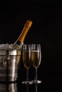 Bottle with champagne and two full wineglasses Royalty Free Stock Photo