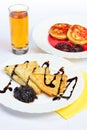 Still life with crepes, cheesecakes and juice. Royalty Free Stock Photo