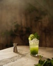 Still life with cucumber drink with ice and mint