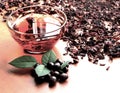 Still life cup of black tea with mint leaves on dried karkade tea background