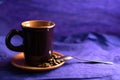 Still life with a cup, coffee beans and spoon Royalty Free Stock Photo