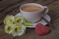 Still life with cup of coffee and flowers Eustoma on wooden back Royalty Free Stock Photo
