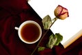 Still life with a cup of tea, a dry rose, a book Royalty Free Stock Photo