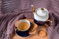 Still life of a cup of tea, teapot and cookies Royalty Free Stock Photo