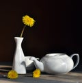 still life with dandelions and white tea-pot Royalty Free Stock Photo