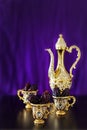 Still life with dates with golden Traditional Arabic coffee set with dallah and mini cup. Royalty Free Stock Photo