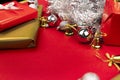 Still life with decoration for Christmas, contains decorative gifts, silver Christmas balls, golden bells and gifts wrapped with g Royalty Free Stock Photo