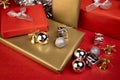 Still life with decoration for Christmas, contains decorative gifts, silver Christmas balls, golden bells and gifts wrapped with g Royalty Free Stock Photo