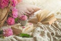 Still life details in home interior of living room. Cup with Pions flowers and spring decor on the books. Read, Rest Royalty Free Stock Photo