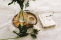 Open book with glasses, cup coffee and bouquet white pink peonies flowers Royalty Free Stock Photo