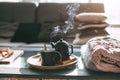 Tea with steam in room in morning sunlight