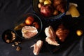 Still life on dinner table on grey background with cheese pieces, pear, walnut, pomelo on wooden board. Pomegranate fruit Royalty Free Stock Photo