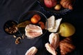 Still life on dinner table on grey background with cheese pieces, pear, walnut, pomelo on wooden board. Pomegranate fruit. Royalty Free Stock Photo