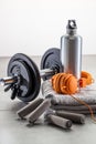 Still-life of dumbbells, hand grip with fashionable earphones Royalty Free Stock Photo