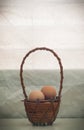 Still life Egg in rattan basket in warming day Royalty Free Stock Photo