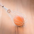 Still life egg in whisk. Royalty Free Stock Photo