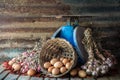 Still life with eggs, onions, garlics, pepper and old blue scales Royalty Free Stock Photo