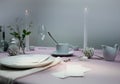 Still life. elegant table setting. tablecloth, candles, antique china - cup, saucer