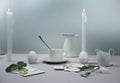 Still life. elegant table setting. tablecloth, candles, antique china - cup, saucer, eggs