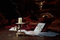 Still life with an extinguished candle, playing cards, and carnival masks Royalty Free Stock Photo