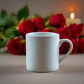 Still life featuring a white mug with red roses and a lit candle in the background creating a romantic scene Royalty Free Stock Photo