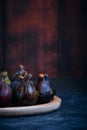 still life figs on a wooden plate Royalty Free Stock Photo