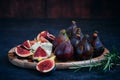 still life figs on a wooden plate Royalty Free Stock Photo