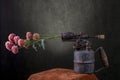 Still life with a flower branch and an old blowtorch Royalty Free Stock Photo