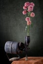 Still life with a flower branch and an old blowtorch Royalty Free Stock Photo