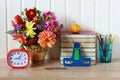 Still life with flowers and books on the desk. back to school Royalty Free Stock Photo