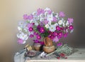 Still life with flowers and cherry berries on colored background