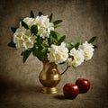 Still life with flowers and red apples.