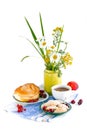 Still life with flowers and red currant bun Royalty Free Stock Photo