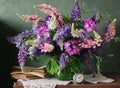 Still life with flowers in a vase. Bouquet of lupine. Royalty Free Stock Photo