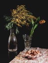 Still life with flowers in vases and dryings. Still Life in a Low Key Royalty Free Stock Photo