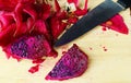 Still life food with knife and red dragon fruits