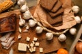 still life of food in a rural style on a dark wood background, lard and garlic, cheese, tomatoes and corn with rye bread, concept Royalty Free Stock Photo