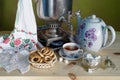 Still life with a Russian samovar ,a cup of tea, sweets and bagels.Russian tea party. Royalty Free Stock Photo