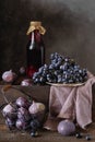 Still life with fresh fruits, fruit juice. grapes, figs, plums Royalty Free Stock Photo